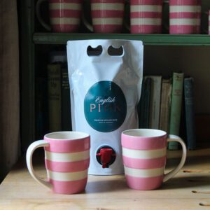 mulled rose pouch on a table with mugs